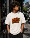Outlaw By Default Graphic Tee — Retro Orange Grunge Logo T-Shirt